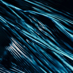 Abstract blue streaks and patterns are displayed.